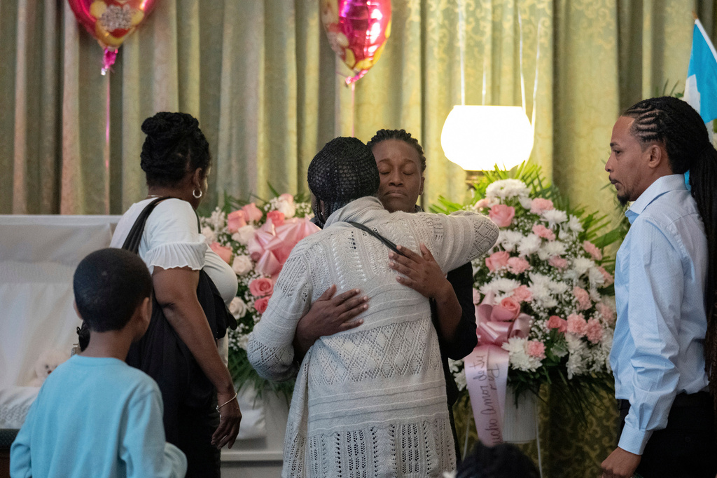 FILE - Mabel Alvarez Benedicks, mother of Anadith Danay Reyes Alvarez, center, greets a guest during the wake for her 8-year-old daughter at R.G. Ortiz Funeral Home in New York, on Friday, June 16, 2023. (AP Photo/Jeenah Moon, File)