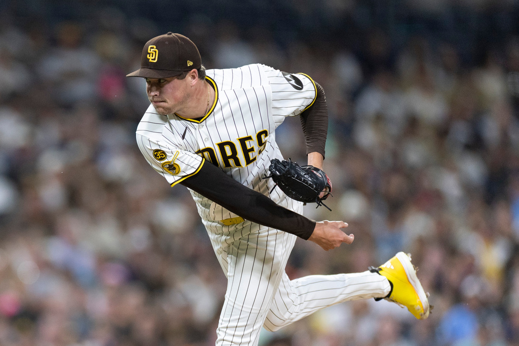 San Diego Padres pitcher Mason Miller works against a Milwaukee Brewers batter in the ninth inning of a baseball game Monday, Aug. 10, 2026, in San Diego. (AP Photo/Karl Anderson)