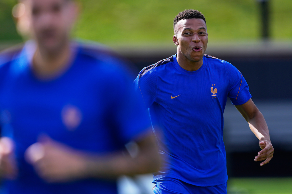 France's Kylian Mbappe smiles during a training session ahead of the team's World Cup Group I soccer match against Iraq in Philadelphia, Sunday, June 21, 2026. (AP Photo/Petr David Josek)