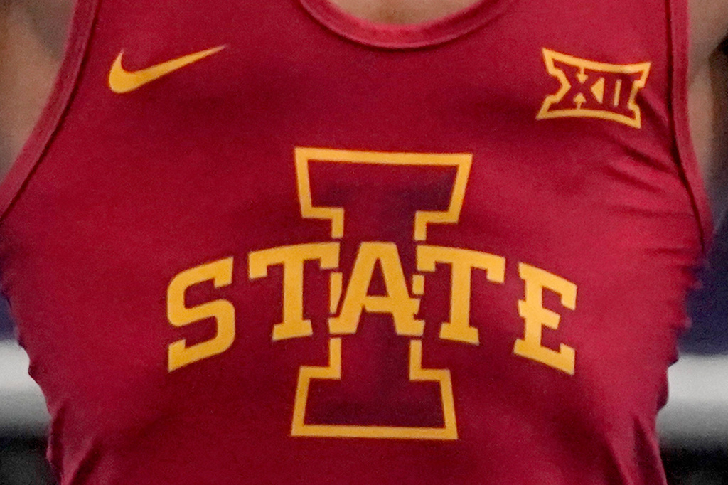 FILE - An Iowa State logo is displayed on a uniform at the NCAA wrestling championships Saturday, March 20, 2021, in St. Louis. (AP Photo/Jeff Roberson, File)