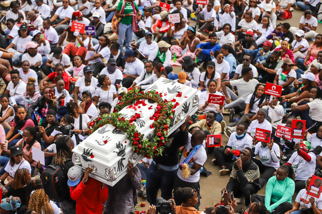 Demonstrators carry a coffin, during a march against rising cases of femicide, in downtown Nairobi, Kenya, Monday, June 1, 2026. (AP Photo/Patrick Ngugi)