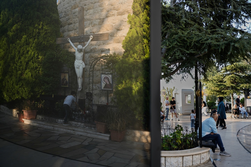 Pilgrims visit and pray around the grounds of the Our Lady of Lebanon shrine in Harissa, east of Beirut, Lebanon, Sunday, Nov. 9, 2025. (AP Photo/Hassan Ammar)