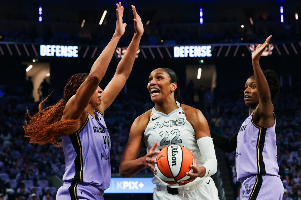 The Golden State Valkyries center Kiah Stokes (41) and guard Kaila Charles (6) block Las Vegas Aces center A'ja Wilson (22) during Game 2 of the WNBA Semifinals in San Francisco, Wednesday, Oct. 7, 2026. (Santiago Mejia/San Francisco Chronicle via AP)