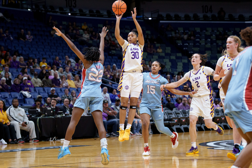 LSU guard Jada Richard (30) shoots over Louisiana Tech guard Jianna Morris (22) during the first half of a NCAA college basketball game Saturday, Dec. 13, 2025, in New Orleans. (AP Photo/Matthew Hinton)