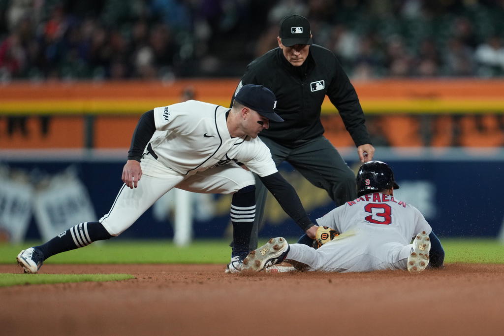 Boston Red Sox's Ceddanne Rafaela (3) steals second base ahead of the tag of Detroit Tigers shortstop Kevin McGonigle during the eighth inning of a baseball game Wednesday, May 6, 2026, in Detroit. (AP Photo/Paul Sancya)