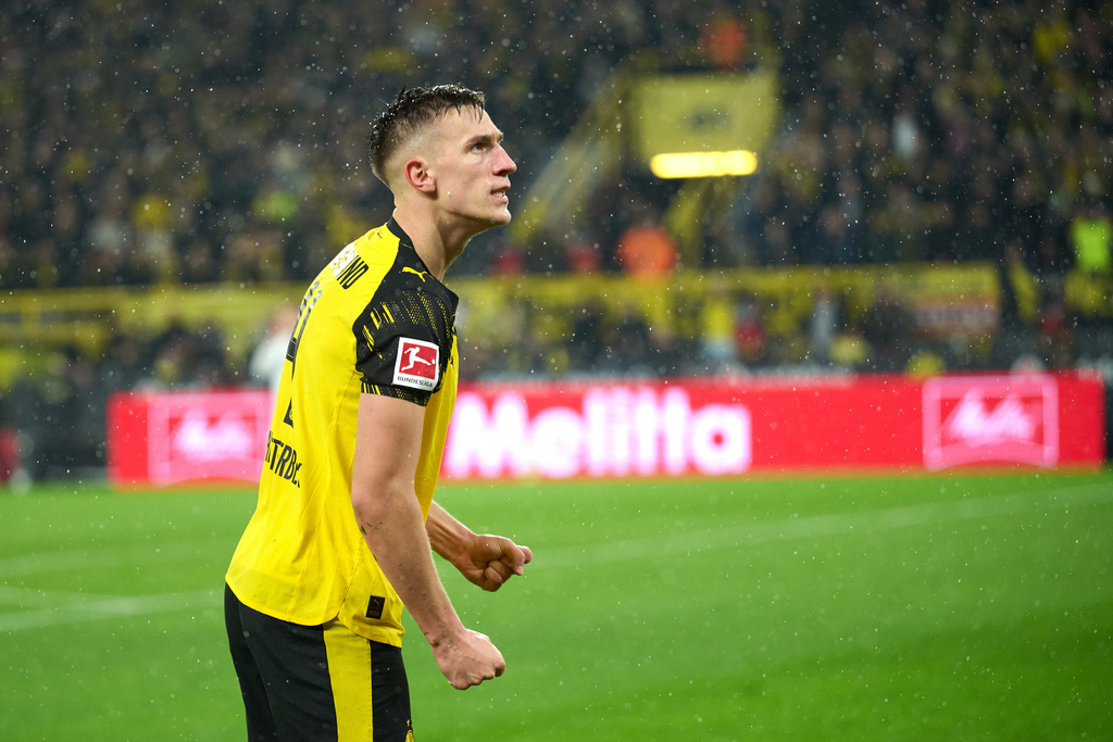 Borussia's Nico Schlotterbeck celebrates after scoring his side's second goal during Germany Bundesliga soccer match between Borussia Dortmund and TSG 1899 Hoffenheim, in Dortmund, Germany, Sunday, Dec. 7, 2025. (Bernd Thissen/dpa via AP)