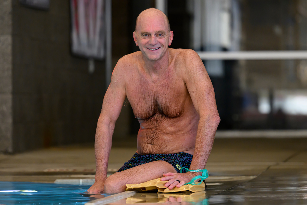 Former Olympic swimmer Rowdy Gaines sits poolside, Tuesday, Nov 11, 2025 at a pool in Salt Lake City. (AP Photo/Tyler Tate)