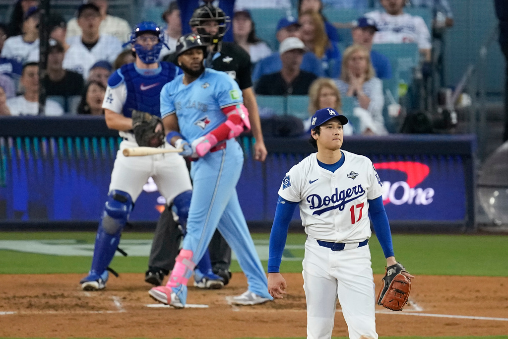 Los Angeles Dodgers pitcher Shohei Ohtani (17) watches Toronto Blue Jays' Vladimir Guerrero Jr's two run home take flight during the third inning in Game 4 of baseball's World Series, Tuesday, Oct. 28, 2025, in Los Angeles. (AP Photo/David J. Phillip)