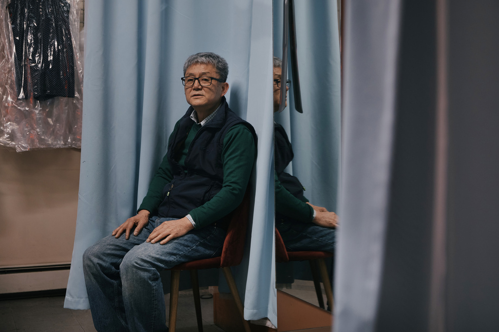 Tailor, Kil Bae, poses for a photo inside his shop on Friday, March 27, 2026, in New York. (AP Photo/Andres Kudacki)