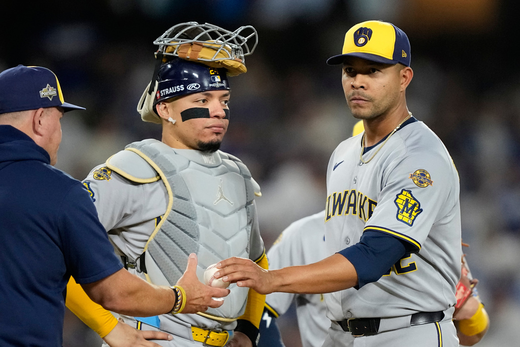 Milwaukee Brewers pitcher Jose Quintana leaves the game against the Los Angeles Dodgers during the third inning in Game 4 of baseball's National League Championship Series, Friday, Oct. 17, 2025, in Los Angeles. (AP Photo/Brynn Anderson)
