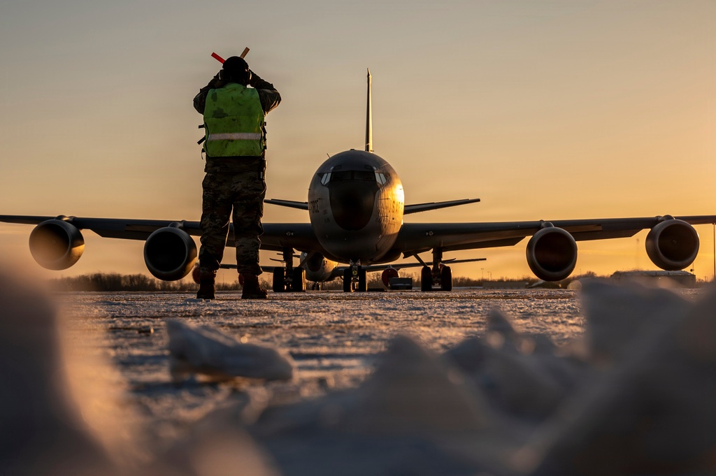 In this Jan. 28, 2026 photo, U.S. Air Force Master Sgt. Aaron Slupski, a crew chief with the 121st Maintenance Group, prepares to marshal a KC-135 Stratotanker at Rickenbacker Air National Guard Base, Columbus, Ohio. Ohio Gov. Mike DeWine said Friday that three of six crew members of an American KC-135 refueling plane were killed when it crashed in Iraq were from his state and had deployed with the Ohio Air National Guard's 121st Air Refueling Wing. (Ralph Branson, U.S. Air National Guard photo via AP)