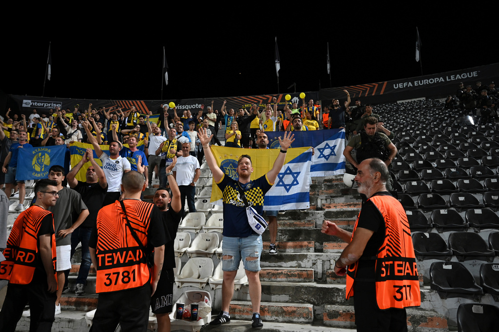 FILE -Maccabi Tel Aviv's fans chant slogans at the end of the Europa League soccer match between PAOK and Maccabi Tel Aviv at Toumpa stadium, in Thessaloniki, Greece, Sept. 24, 2025. (AP Photo/Giannis Papanikos), File)
