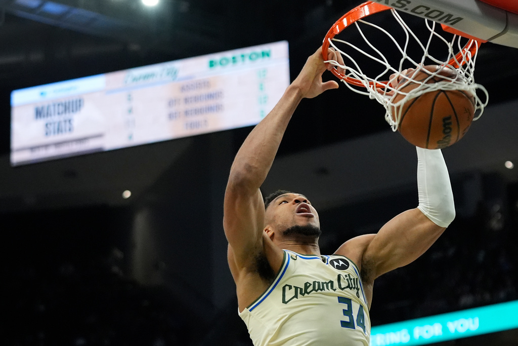 Milwaukee Bucks' Giannis Antetokounmpo dunks during the first half of an NBA basketball game against the Boston Celtics, Monday, March 2, 2026, in Milwaukee. (AP Photo/Aaron Gash)