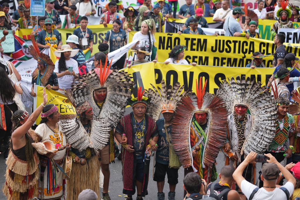 Activists participate in a climate protest during the COP30 U.N. Climate Summit, Saturday, Nov. 15, 2025, in Belem, Brazil. (AP Photo/Andre Penner)
