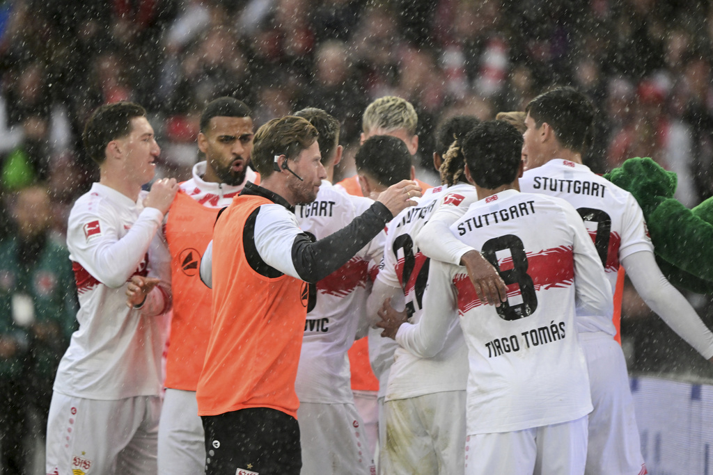 Stuttgart players celebrate Bilal El Khannouss' goal during the Bundesliga soccer match between VfB Stuttgart and 1. FC Heidenheim at MHPArena, Stuttgart, Germany, Sunday Oct. 5, 2025. (Bernd Weissbrod/dpa via AP)
