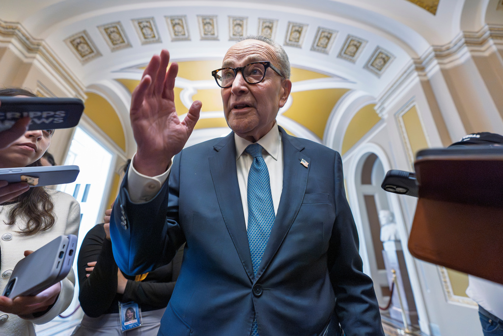 Senate Minority Leader Chuck Schumer, D-N.Y., talks to reporters as he departs for a meeting with President Donald Trump and the top four congressional leaders to discuss the looming government funding crisis, at the Capitol in Washington, Monday, Sept. 29, 2025. (AP Photo/J. Scott Applewhite)