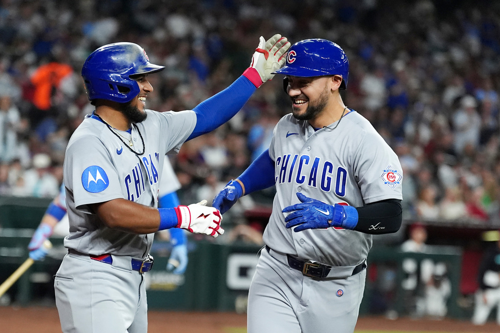 Chicago Cubs' Michael Conforto, right, celebrates his two-run home run against the Arizona Diamondbacks with Cubs' Pedro Ramírez during the sixth inning of a baseball game, Monday, Aug. 24, 2026, in Phoenix. (AP Photo/Ross D. Franklin)