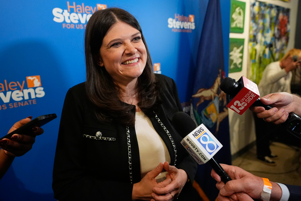 Rep. Haley Stevens, D-Mich., talks to reporters during a campaign event, Monday, Aug. 3, 2026, in Grand Rapids, Mich. (AP Photo/Paul Sancya)