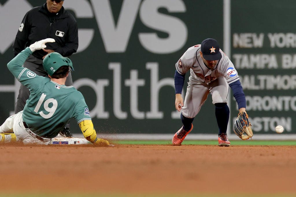 Boston Red Sox designated hitter Roman Anthony, left, slides safely into second base as Houston Astros second baseman Jose Altuve, right, fields the ball during the fifth inning of a baseball game Friday, May 1, 2026, in Boston. (AP Photo/Mark Stockwell)