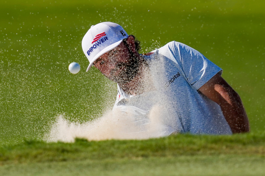 Cameron Young hits from the 16th green bunker during the third round of the Cadillac Championship PGA golf tournament Saturday, May 2, 2026, in Doral, Fla. (AP Photo/David J. Phillip)