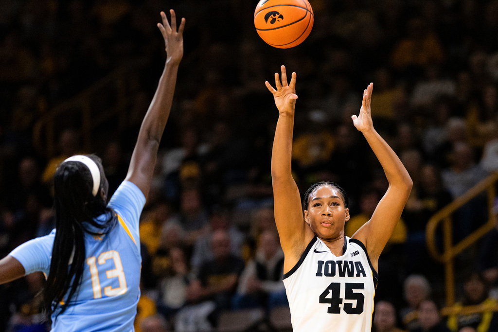 Iowa Hawkeyes forward Hannah Stuelke (45) shoots the ball against a Southern player during an NCAA college basketball game in Iowa City, Iowa, Monday, Nov. 3, 2025. (Nick Rohlman/The Gazette via AP)