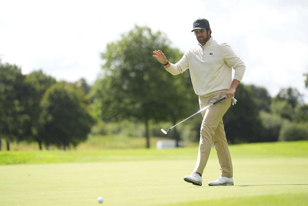Nacho Elvira, of Spain, waves after a putt during the Irish Open golf tournament, Thursday, Sept. 4, 2025, at The K Club in Straffan, Ireland. (Brian Lawless/PA via AP)