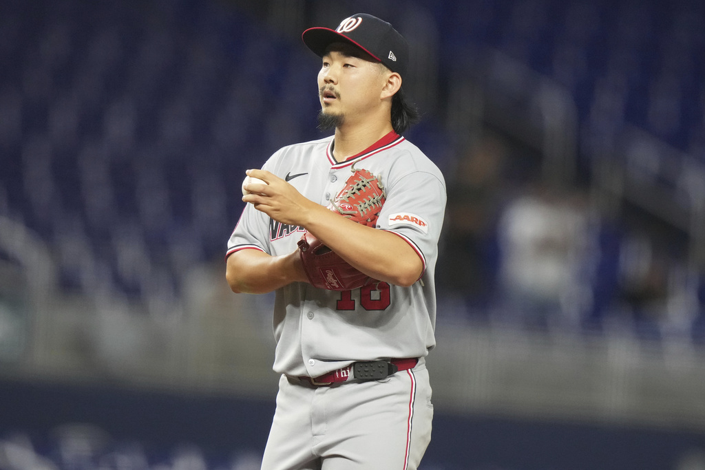Washington Nationals relief pitcher Shinnosuke Ogasawara (16), of Japan, stands on the mound after giving up a solo home run to Miami Marlins' Jakob Marsee during the ninth inning of a baseball game, Monday, Sept. 8, 2025, in Miami. (AP Photo/Lynne Sladky)