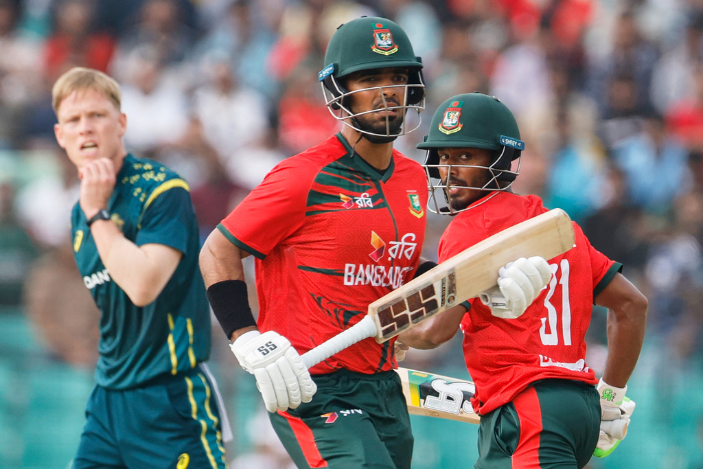 Bangladesh's Tanzid Hasan Tamim, right, and Saif Hassan run between the wickets to score during the second T20 international cricket match between Australia and Bangladesh, in Chattogram, Bangladesh, Friday, June 19, 2026. (AP Photo/Mosaraf Hossain)