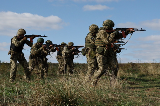 In this photo provided by Ukraine's 65th Mechanized Brigade press service, recruits run drills at a training ground in the Zaporizhzhia region, Ukraine, Friday, Sept. 26, 2025. (Andriy Andriyenko/Ukraine's 65th Mechanized Brigade via AP) In this photo provided by Ukraine's 65th Mechanized Brigade press service, recruits run drills at a training ground in the Zaporizhzhia region, Ukraine, Friday, Sept. 26, 2025. (Andriy Andriyenko/Ukraine's 65th Mechanized Brigade via AP)