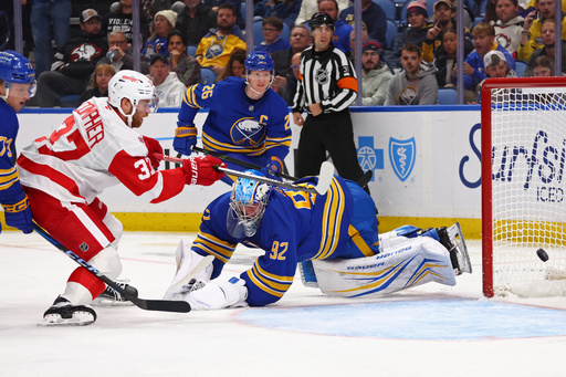 Detroit Red Wings left wing J.T. Compher (37) puts the puck past Buffalo Sabres goaltender Colten Ellis (92) during the second period of an NHL hockey game Wednesday, Oct. 22, 2025, in Buffalo, N.Y. (AP Photo/Jeffrey T. Barnes) Detroit Red Wings left wing J.T. Compher (37) puts the puck past Buffalo Sabres goaltender Colten Ellis (92) during the second period of an NHL hockey game Wednesday, Oct. 22, 2025, in Buffalo, N.Y. (AP Photo/Jeffrey T. Barnes)
