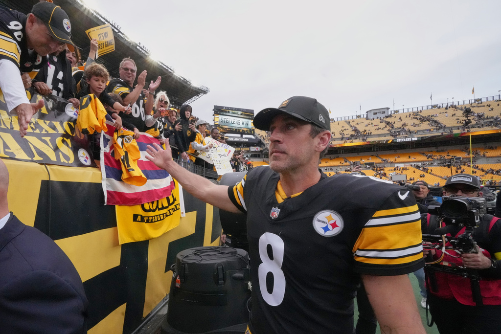 Pittsburgh Steelers quarterback Aaron Rodgers (8) walks off the field after the Steelers defeated the Cleveland Browns in an NFL football game in Pittsburgh, Sunday, Oct. 12, 2025. (AP Photo/Gene J. Puskar)