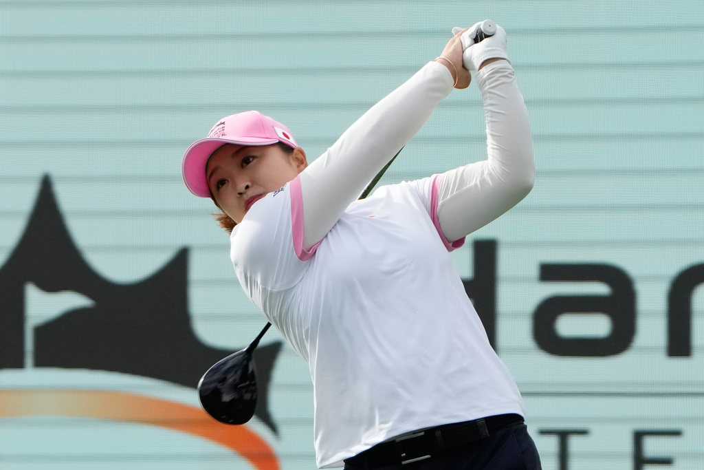 Mao Saigo of Japan hits her tee shot on the 1st hole during the pool B match against the World Team for the LPGA International Crown golf tournament at the New Korea Country Club in Goyang, South Korea, Thursday, Oct. 23, 2025. (AP Photo/Ahn Young-joon)