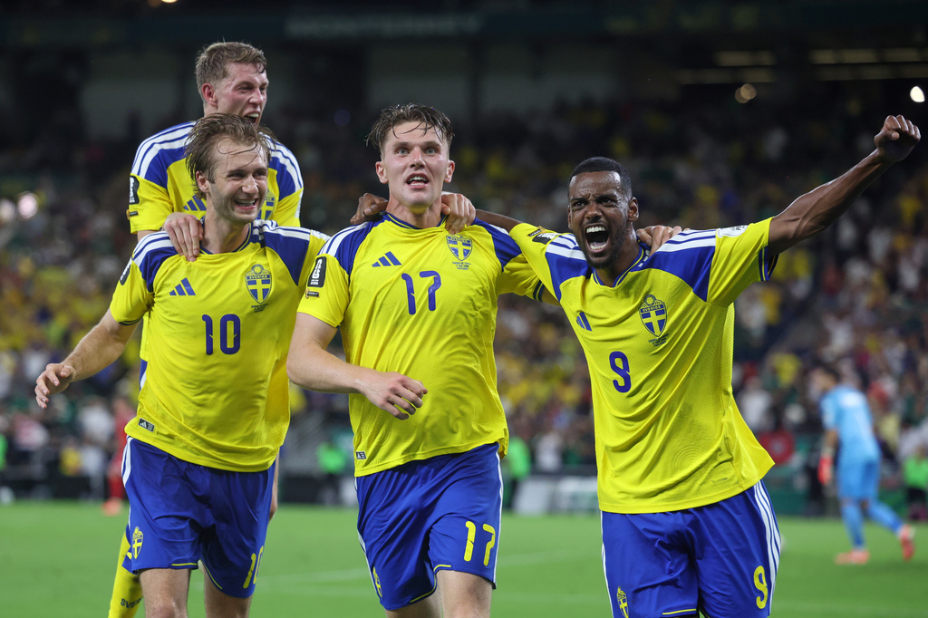 Sweden's Alexander Bernhardsson, Sweden's Benjamin Nygren (10) and Sweden's Alexander Isak (9) celebrate with Sweden's Viktor Gyokeres (17) after he scored to put Sweden up, 3-1, during the World Cup Group F soccer match between Sweden and Tunisia in Guadalupe, near Monterrey, Mexico, Sunday, June 14, 2026. (AP Photo/Sofia Yaker)