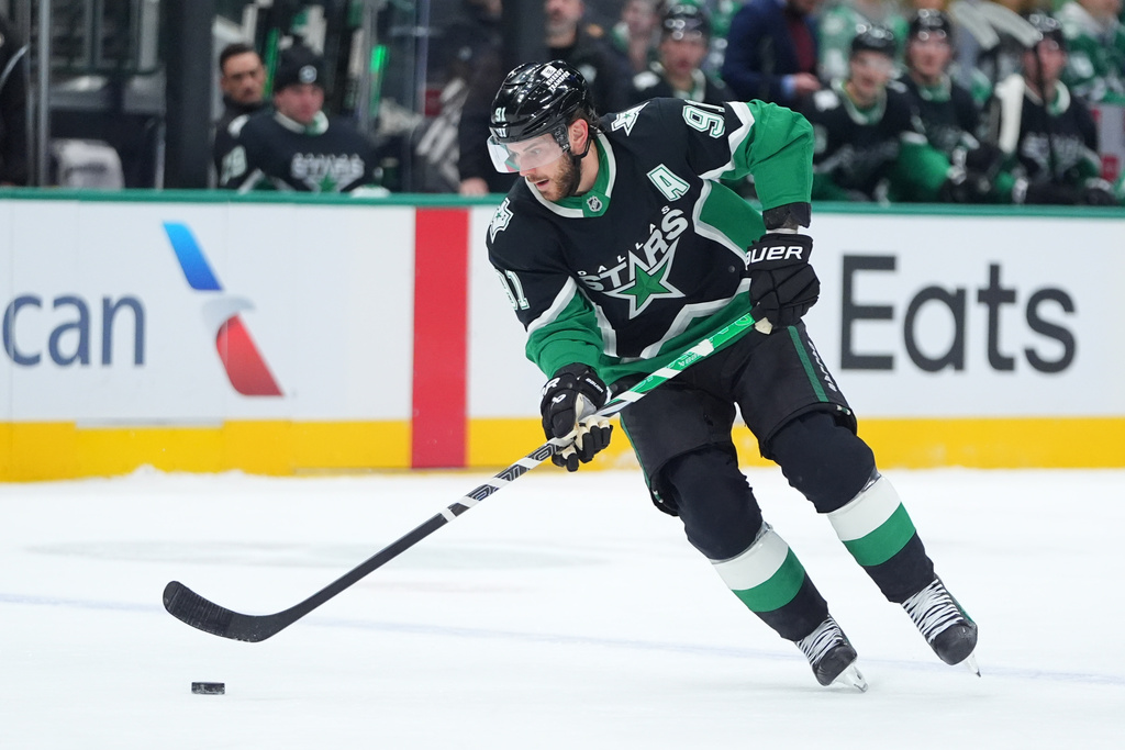 Dallas Stars center Tyler Seguin skates with the puck during the first period of an NHL hockey game against the Ottawa Senators, Sunday, Nov. 30, 2025, in Dallas. (AP Photo/LM Otero)