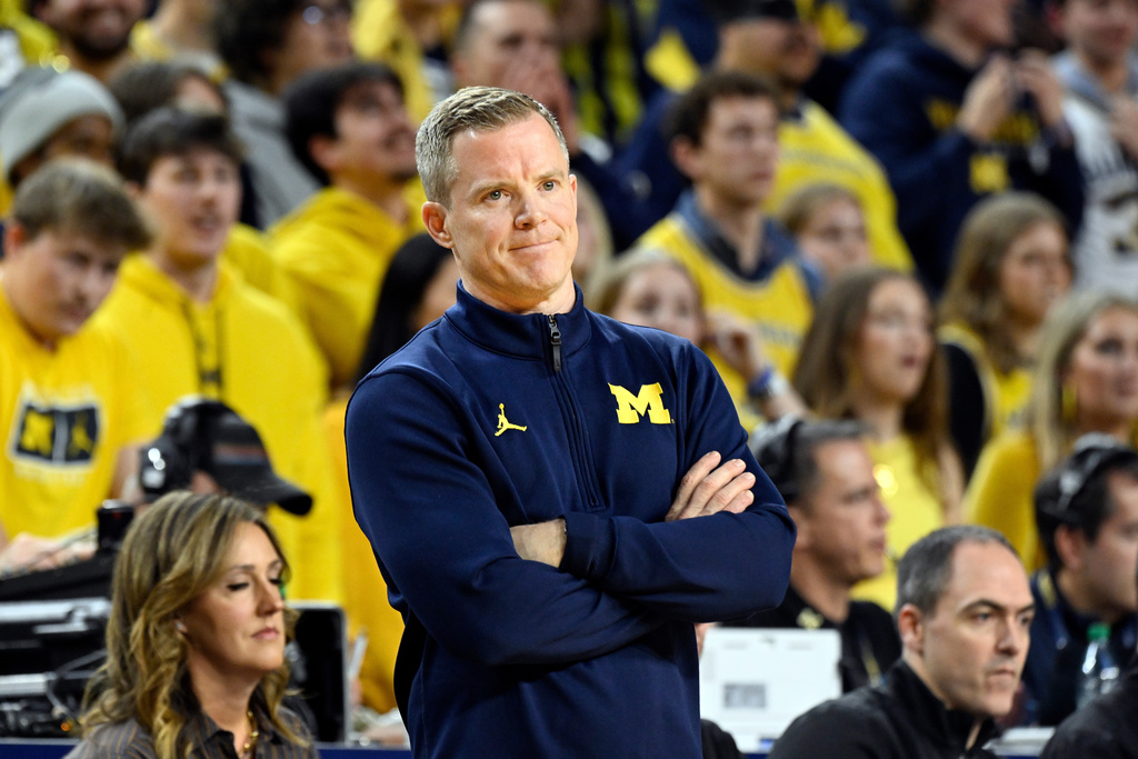 Michigan head coach Dusty May watches his team play during the first half of an NCAA college basketball game against Ohio State, Friday, Jan. 23, 2026, in Ann Arbor, Mich. (AP Photo/Jose Juarez)