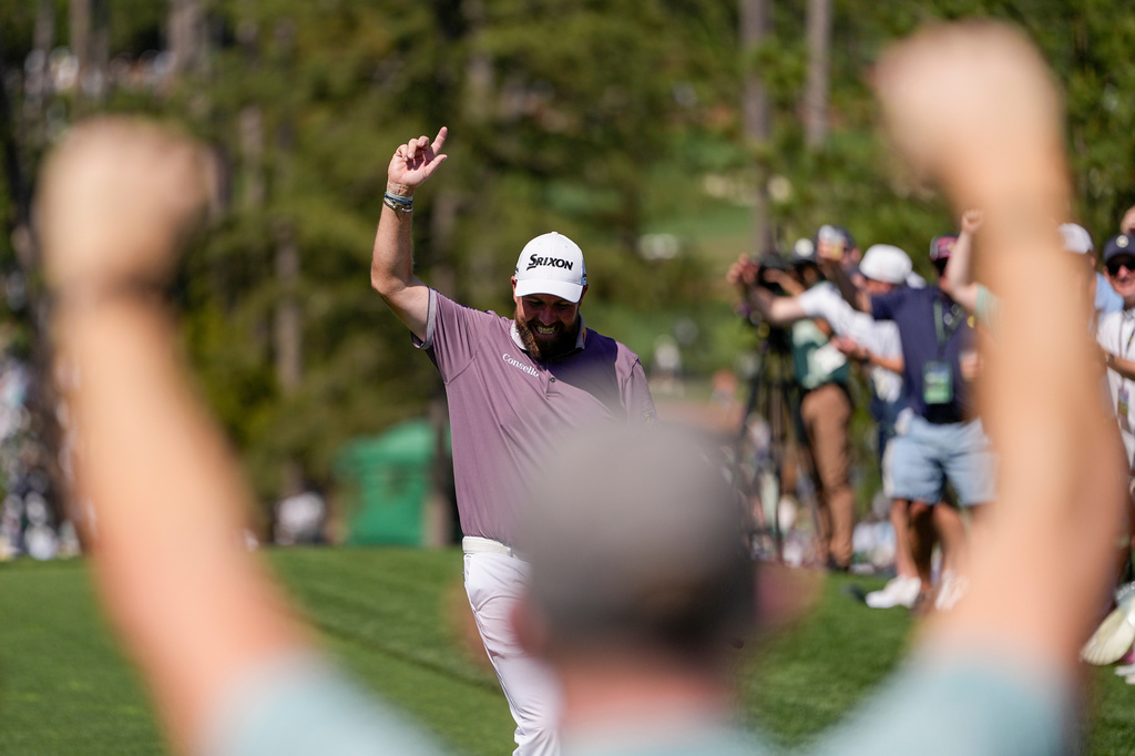 Shane Lowry, of Ireland, waves after a hole-in-one on the sixth hole during the third round of the Masters golf tournament at the Augusta National Golf Club, Saturday, April 11, 2026, in Augusta, Ga. (AP Photo/Ashley Landis)