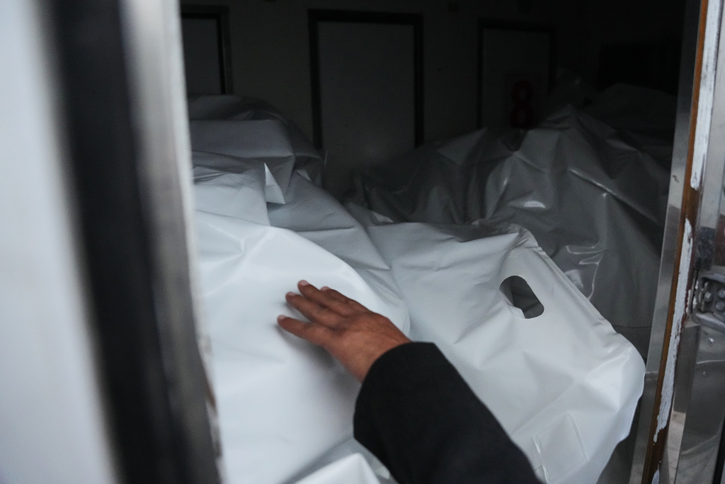 Bodies of Palestinians returned from Israel as part of the ceasefire deal are brought to Shifa Hospital, in Gaza City, Thursday, Jan. 29, 2026. (AP Photo/Abdel Kareem Hana)