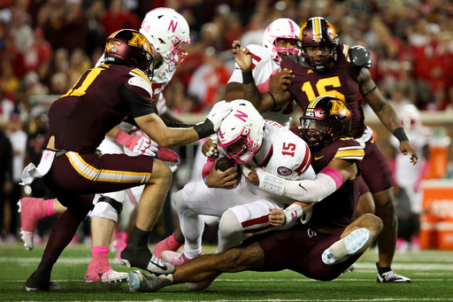 Minnesota defensive lineman Anthony Smith, right, sacks Nebraska quarterback Dylan Raiola (15) during the first half of an NCAA college football game, Friday, Oct. 17, 2025, in Minneapolis. (AP Photo/Ellen Schmidt) Minnesota defensive lineman Anthony Smith, right, sacks Nebraska quarterback Dylan Raiola (15) during the first half of an NCAA college football game, Friday, Oct. 17, 2025, in Minneapolis. (AP Photo/Ellen Schmidt)