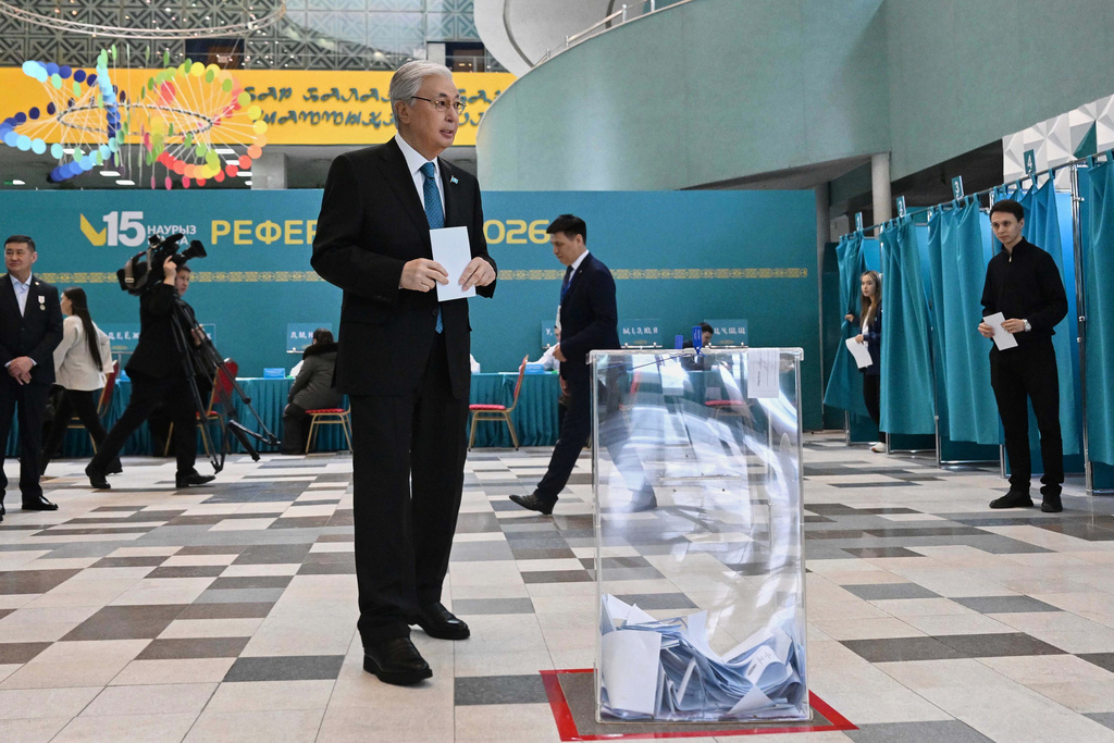 In this photo released by Kazakhstan's President Press Office, Kazakhstan's President Kassym-Jomart Tokayev walks to cast his ballot at a polling station during a referendum on a new constitution, in Astana, Kazakhstan, Sunday, March 15, 2026. (Kazakhstan's President Press Office via AP)