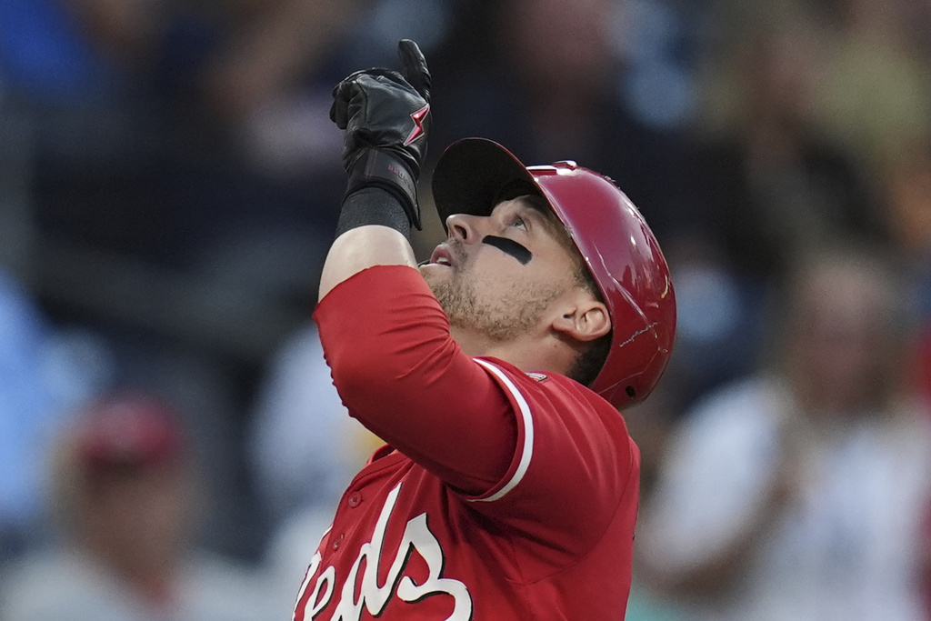 Cincinnati Reds' TJ Friedl celebrates after hitting a home run during the first inning of a baseball game against the San Diego Padres Monday, Sept. 8, 2025, in San Diego. (AP Photo/Gregory Bull)