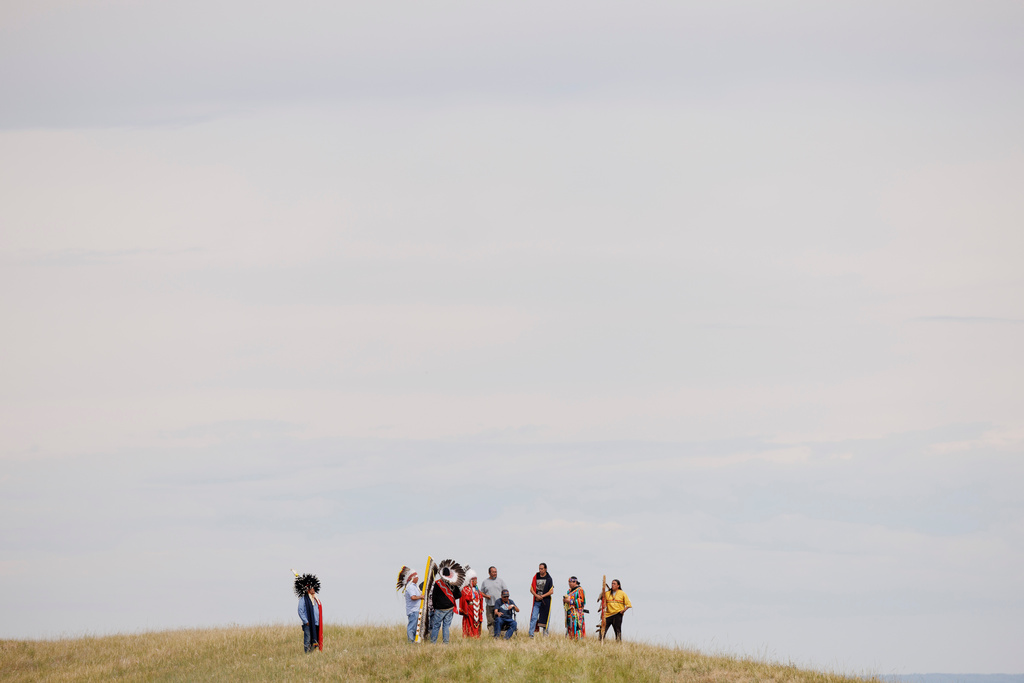 Elders representing each tribe present wait for the horse charging during festivities to commemorate the 150th anniversary of the Battle of the Little Bighorn in Crow Agency, Mont., on Thursday, June 25, 2026. (AP Photo/Tailyr Irvine)