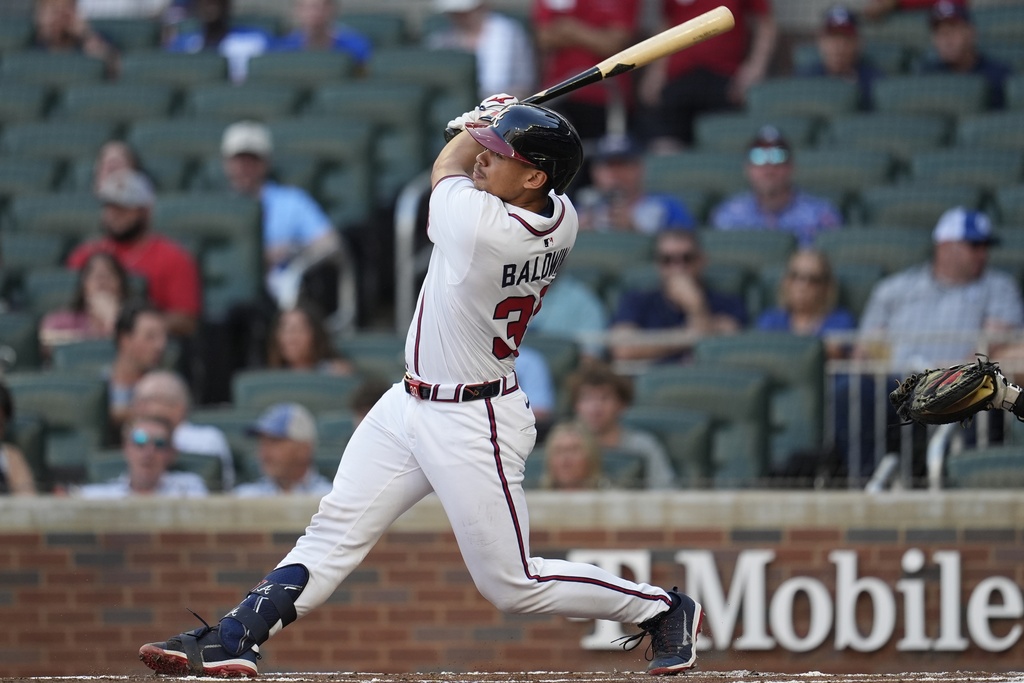 Atlanta Braves' Drake Baldwin (30) hits a solo home run against the Miami Marlins in the first inning of a baseball game, Thursday, Aug. 7, 2025, in Atlanta. (AP Photo/Mike Stewart)