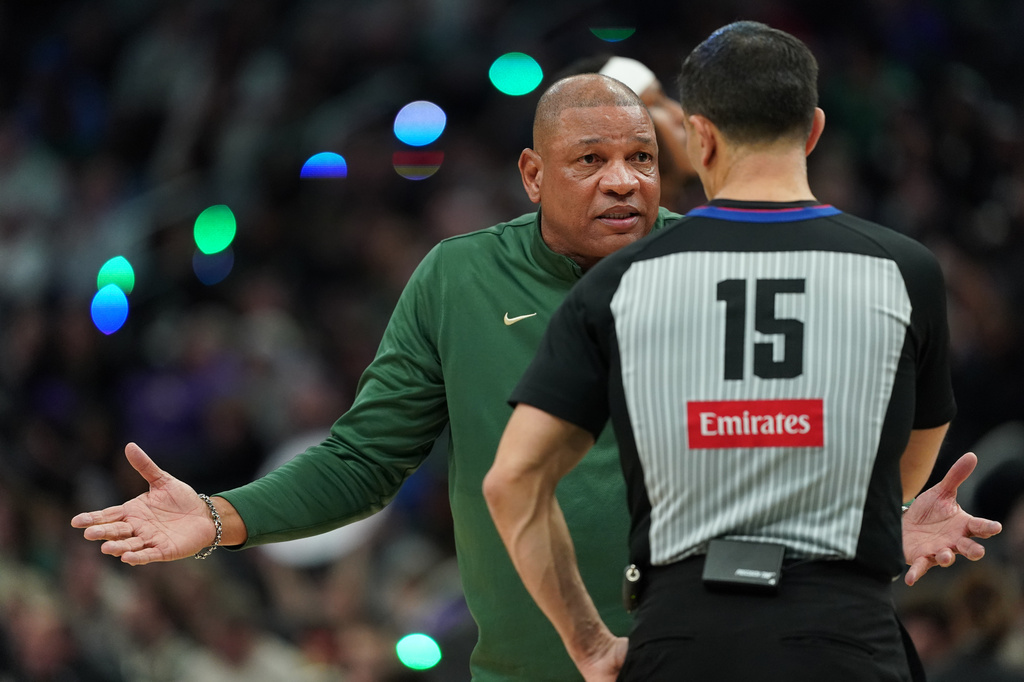 Milwaukee Bucks head coach Doc Rivers reacts as he talks with an official during the first half of an NBA basketball game against the San Antonio Spurs, Saturday, March 28, 2026, in Milwaukee. (AP Photo/Aaron Gash)