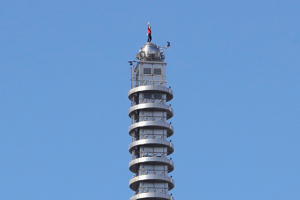 Rock climber Alex Honnold, of the U.S., raises his fist as he climbs on top of the Taipei 101 skyscraper in Taipei, Taiwan, Sunday, Jan. 25, 2026. (AP Photo/Chiang Ying-ying)