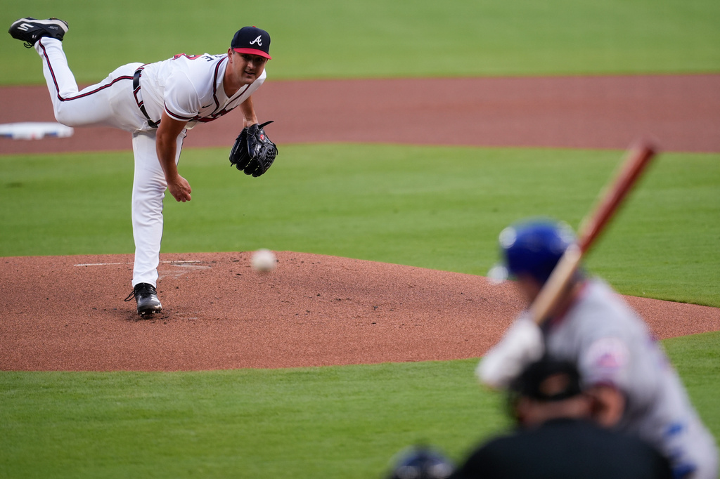 Atlanta Braves pitcher Tyler Mahle (54) delivers to New York Mets' A.J. Ewing in the first inning of a baseball game, Wednesday, Aug. 12, 2026, in Atlanta. (AP Photo/Mike Stewart)
