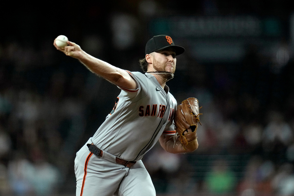 San Francisco Giants starting pitcher Landen Roupp throws against the Arizona Diamondbacks during the first inning of a baseball game, Tuesday, June 30, 2026, in Phoenix. (AP Photo/Ross D. Franklin)