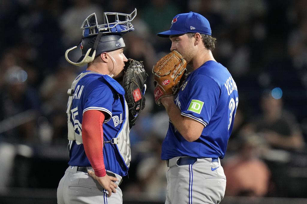 Toronto Blue Jays pitcher Trey Yesavage talks to catcher Tyler Heineman, left, during the first inning of a baseball game against the Tampa Bay Rays Monday, Sept. 15, 2025, in Tampa, Fla. (AP Photo/Chris O'Meara)