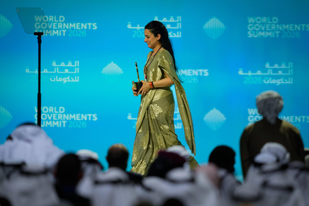 Indian teacher Rouble Nagi walks off the stage after receiving the Global Teacher Prize trophy from Dubai Crown Prince Sheikh Hamdan bin Mohammed Al Maktoum at a ceremony in Dubai, United Arab Emirates, Thursday, Feb. 5, 2026. (AP Photo/Altaf Qadri)