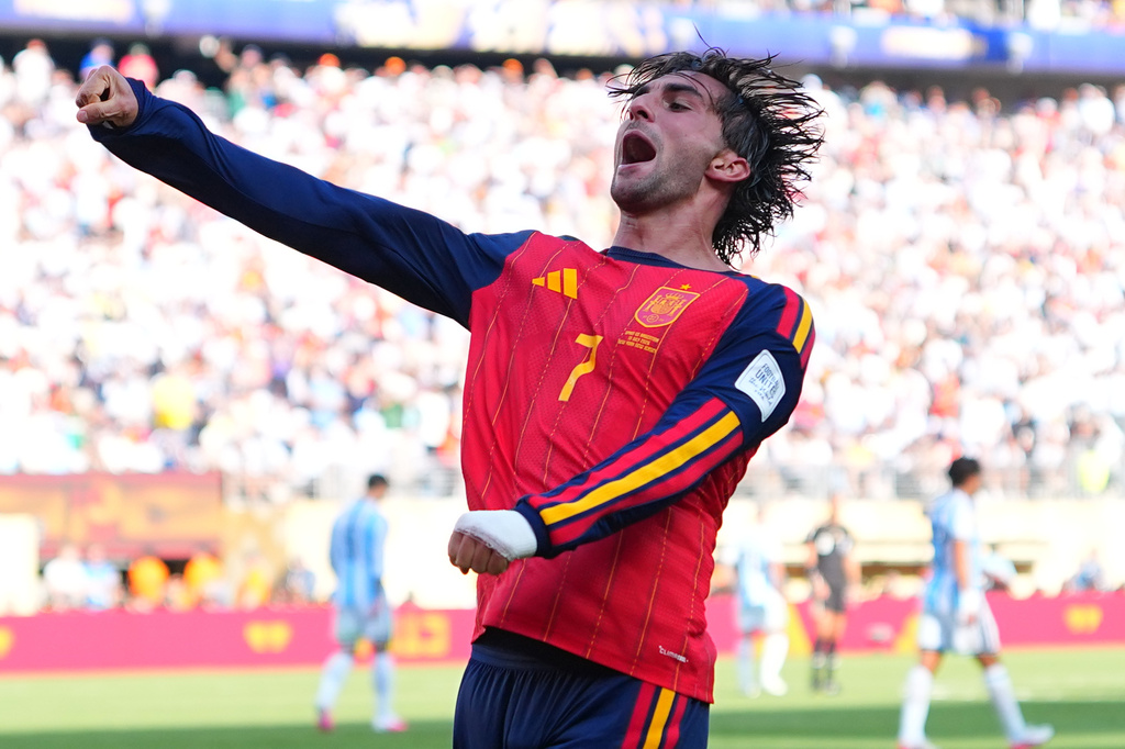 Spain's Ferran Torres (7) celebrates scoring their first goal during the World Cup final soccer match between Spain and Argentina in East Rutherford, N.J., near New York, Sunday, July 19, 2026. (AP Photo/Julio Cortez)