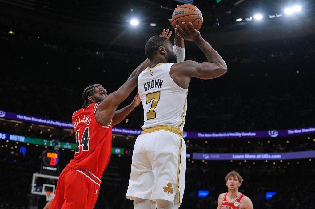 Boston Celtics guard Jaylen Brown (7) looks to shoot after driving past Chicago Bulls forward Patrick Williams (44) during the first half of an NBA basketball game, Monday, Jan. 5, 2026, in Boston. (AP Photo/Charles Krupa)